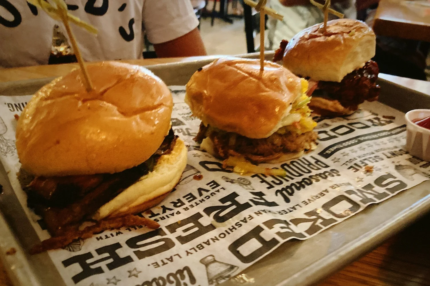 Trio of sliders — brisket, pulled pork, and fried chicken